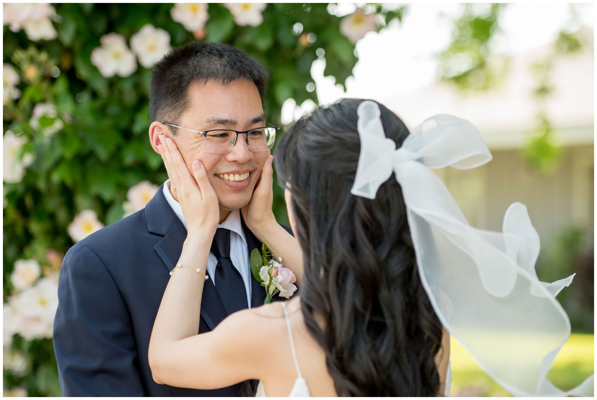 Bride smiling holding wedding bouquet